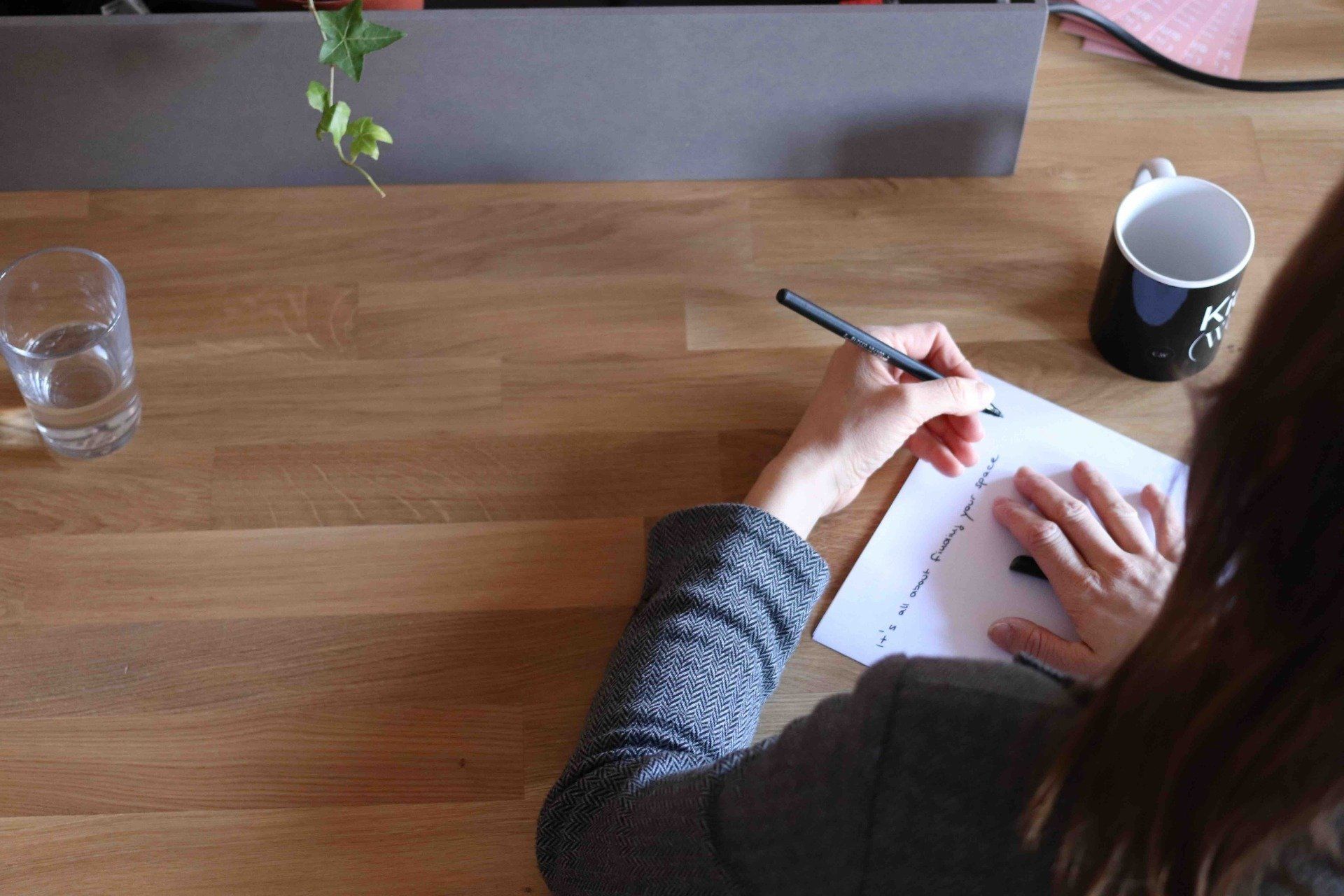 A woman writing journal notes