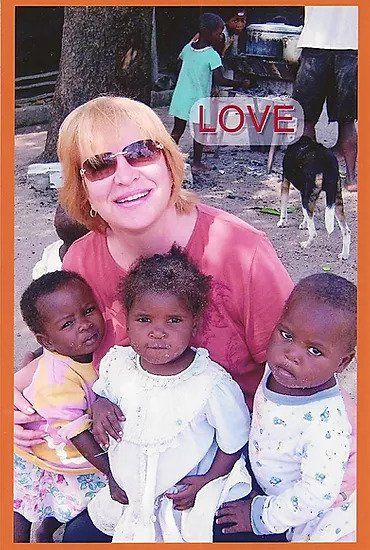 A woman holding three children with the word love on the bottom