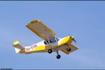 A yellow and white plane with the letters zu-evb on the side