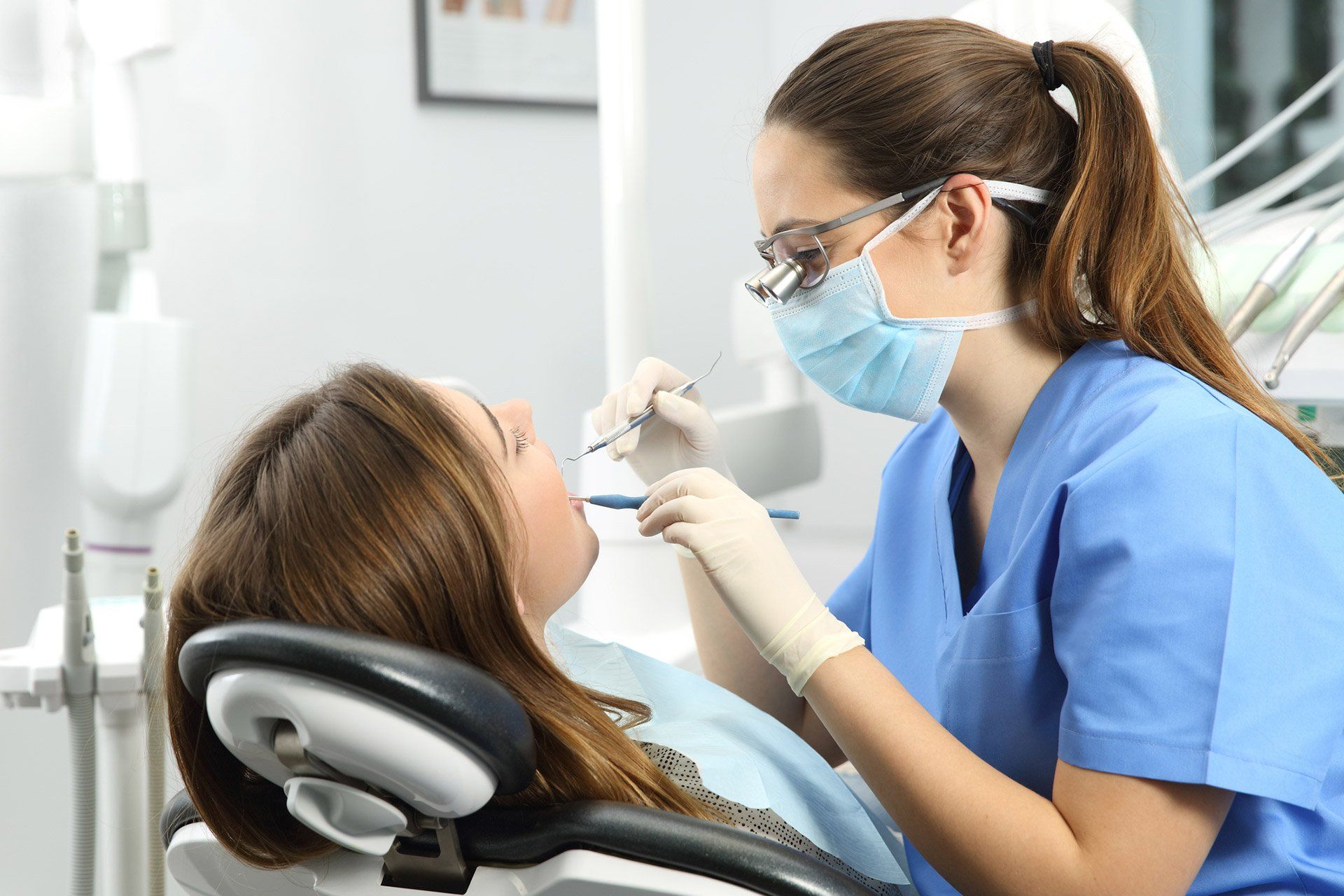 woman getting her teeth examined - Glenville Smiles -Schenectady, NY