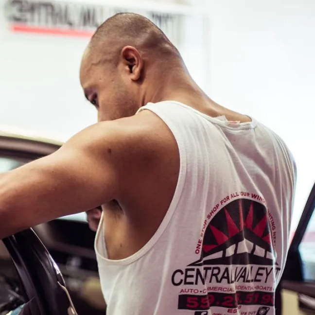 A man wearing a tank top that says central valley
