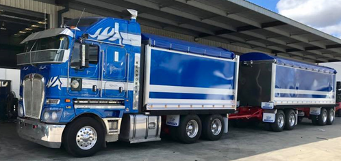 side view of a blue  Hercules truck