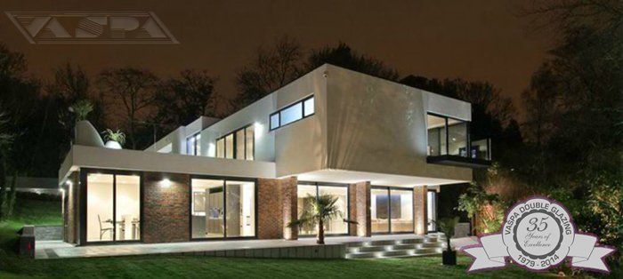 Building with lit windows and dark sky