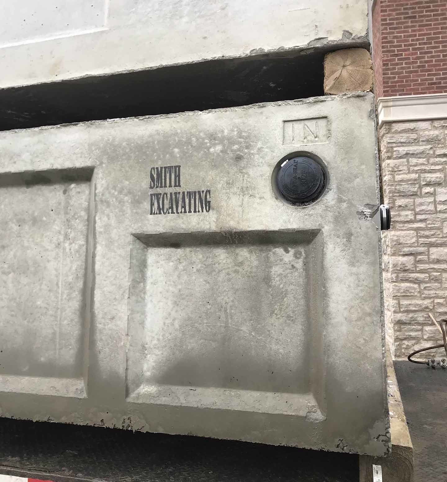 Concrete panels stacked, one labeled