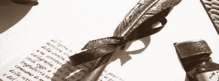 Feather pen and paper