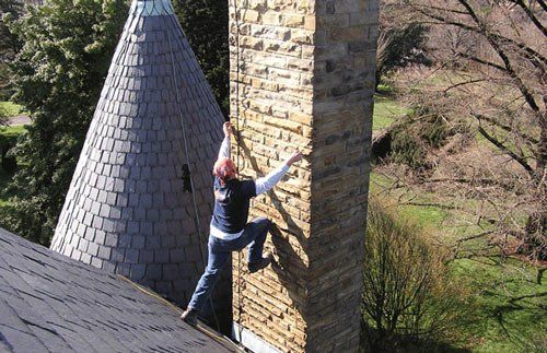 Worker Preparing to Climb Chimney - Chimney Repair in Ruther Glen, VA Worker Preparing to Climb Chimney - Chimney Repair in Ruther Glen, VA
