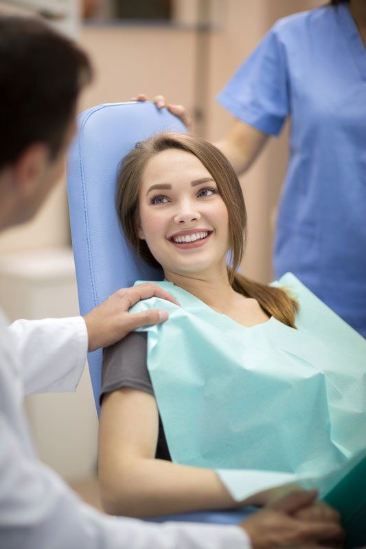 Dentist Comforting Patient — Murfreesboro, TN — Fortress Dental Dentist Comforting Patient — Murfreesboro, TN — Fortress Dental