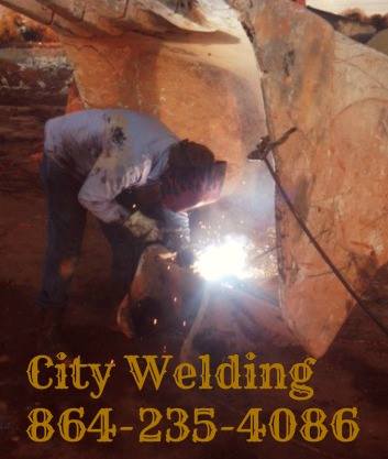 Man Welding Steel — Welding Services in Greenville, SC