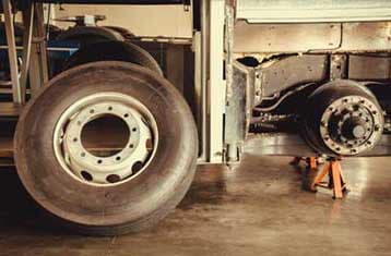 Spare wheel tire and axle bus on lifting jack - Welding Services in Greenville, SC Spare wheel tire and axle bus on lifting jack - Welding Services in Greenville, SC