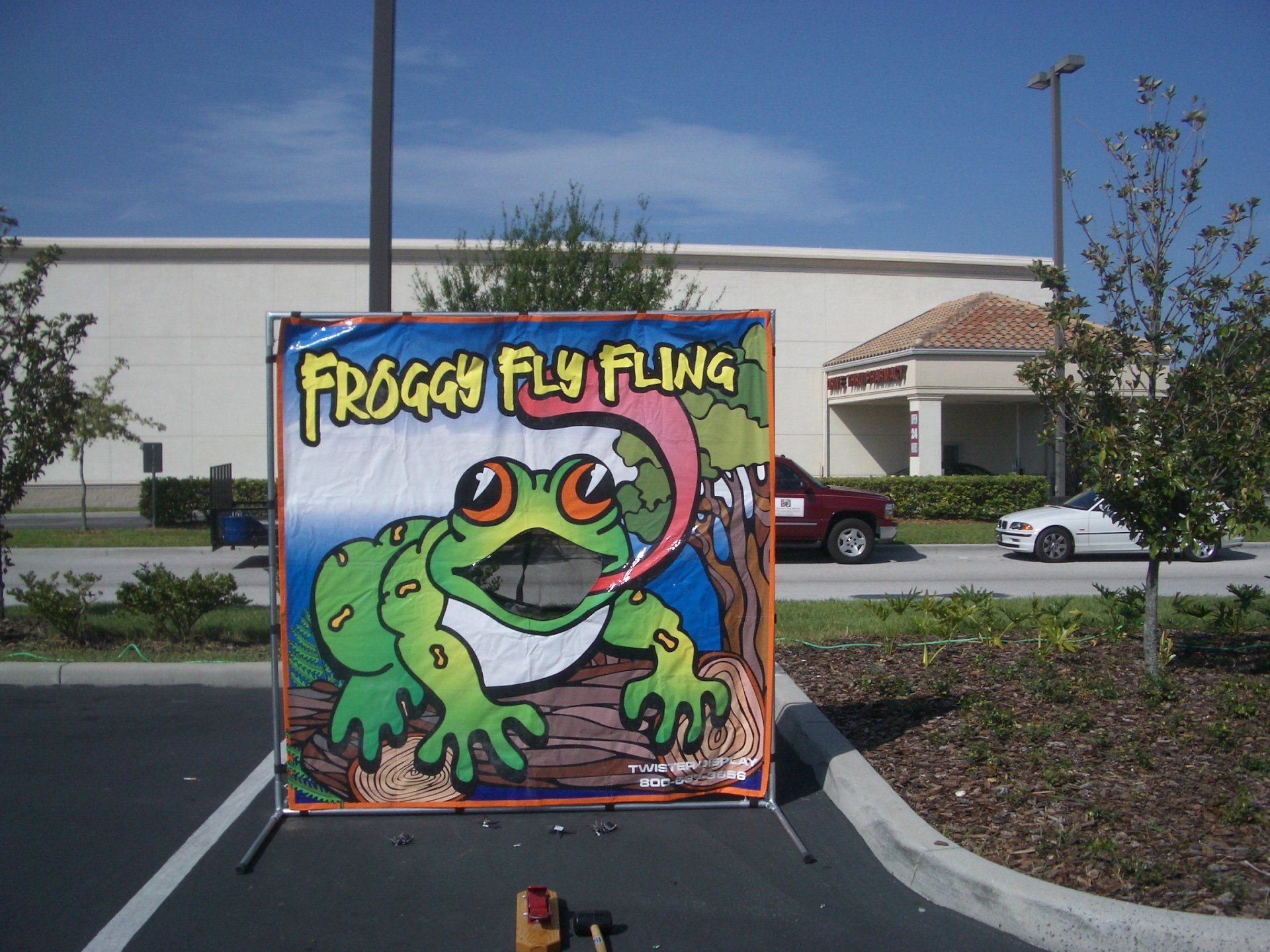  A fun, carnival-style game featuring a large cartoon frog with an open mouth as the target for players to aim at.