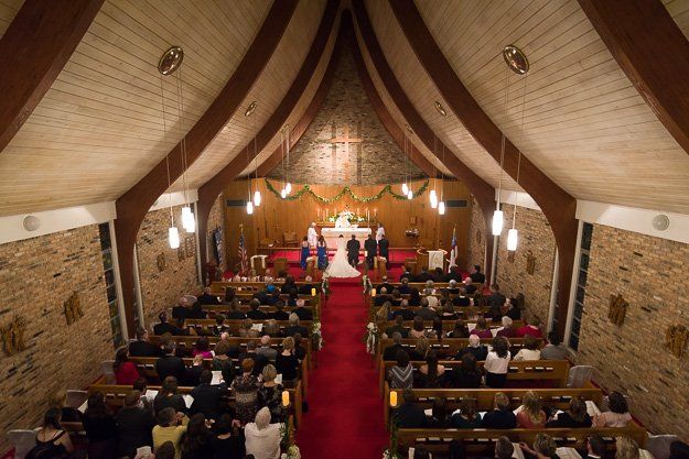 a bride and groom are getting married in a church