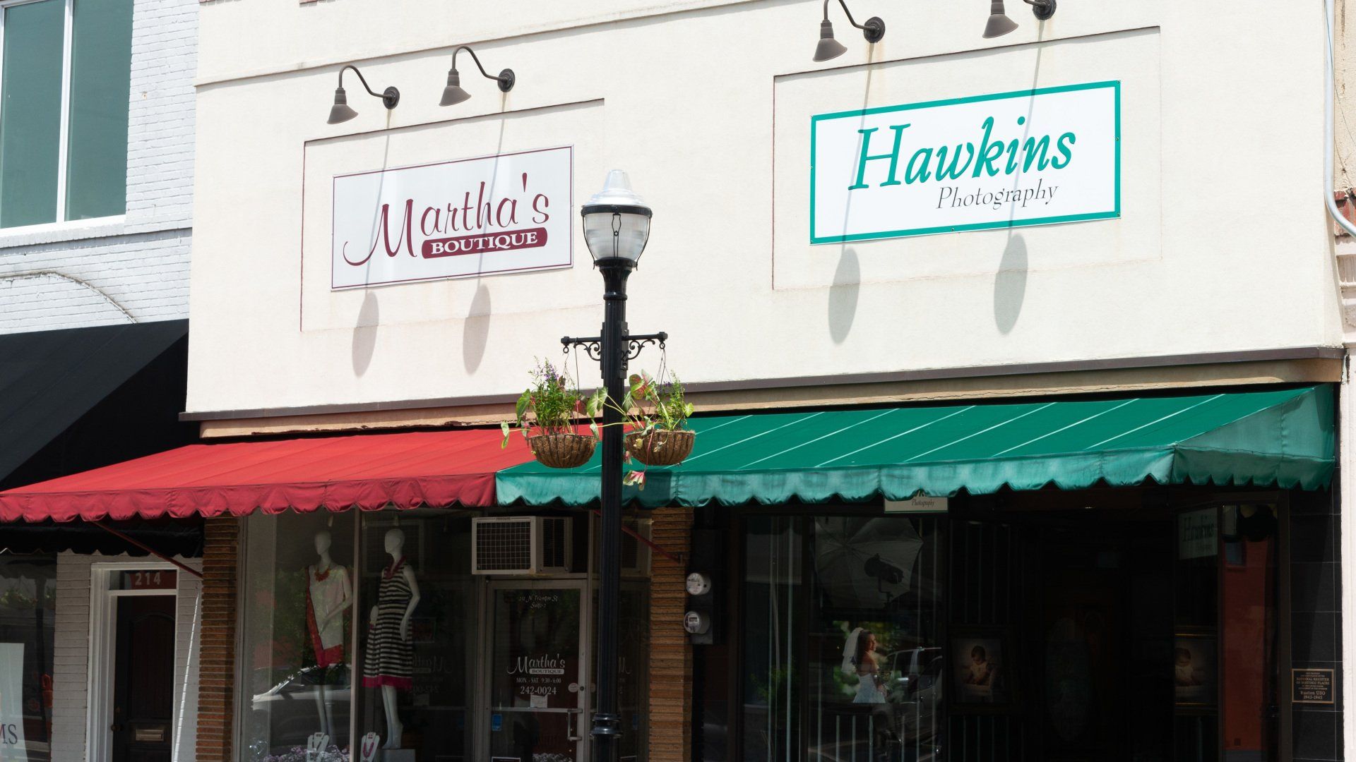 Two hawkins stores are on a city street