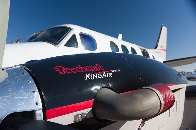 a beechcraft kingair plane is parked on the tarmac