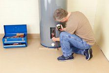 Man installating water heater Man installating water heater