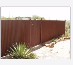 Brown corrugated metal fence.