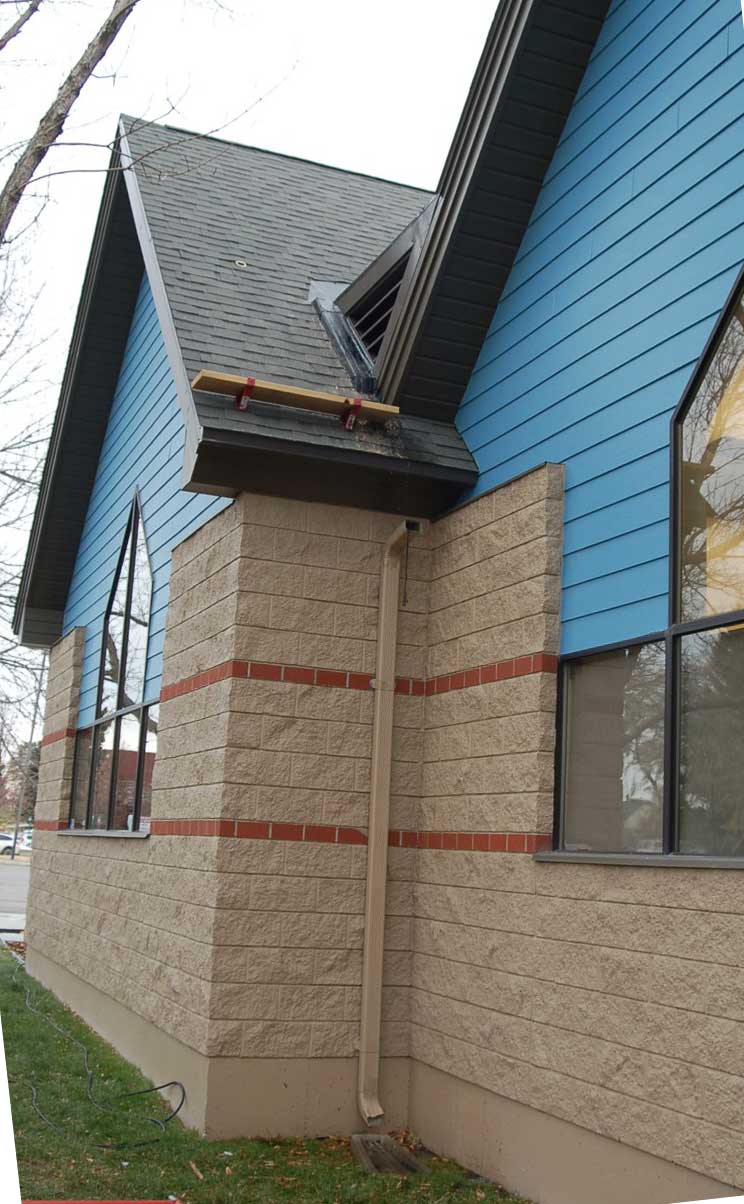 Men Cleaning Commercial Gutter— Helena, MT — Continuous Rain Gutter Co.