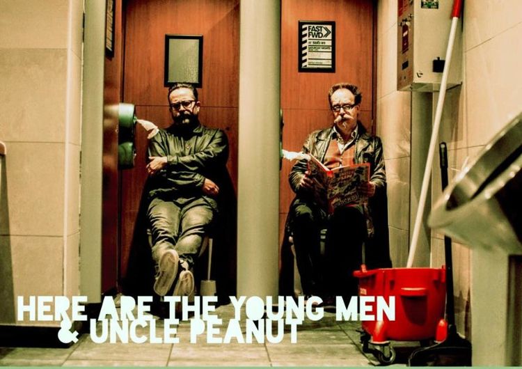 Two men are sitting in an elevator with the words here are the young men and uncle peanut below them
