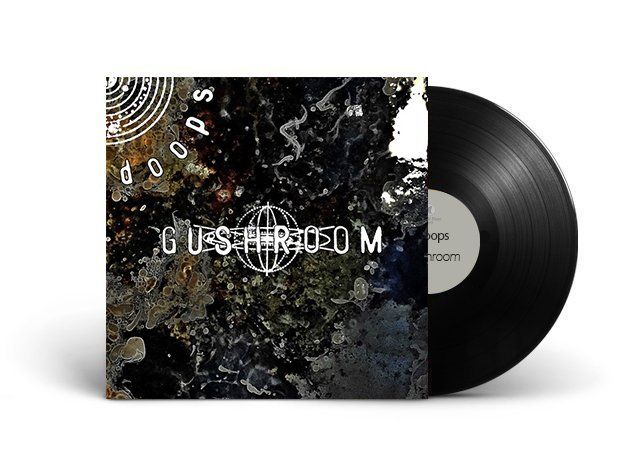 A black record is sitting on top of a white surface.