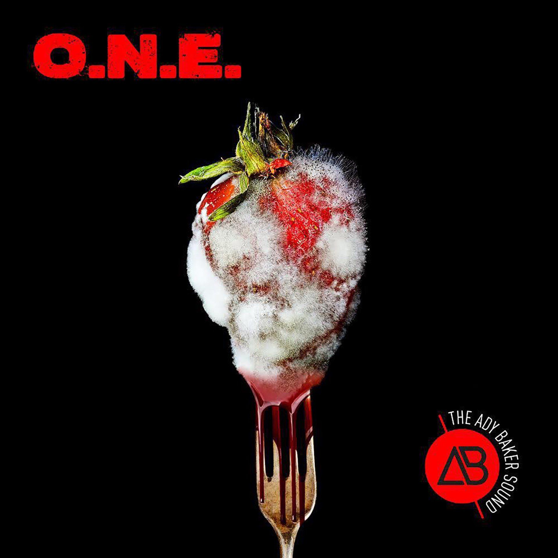 A strawberry with white foam on it is on a fork.