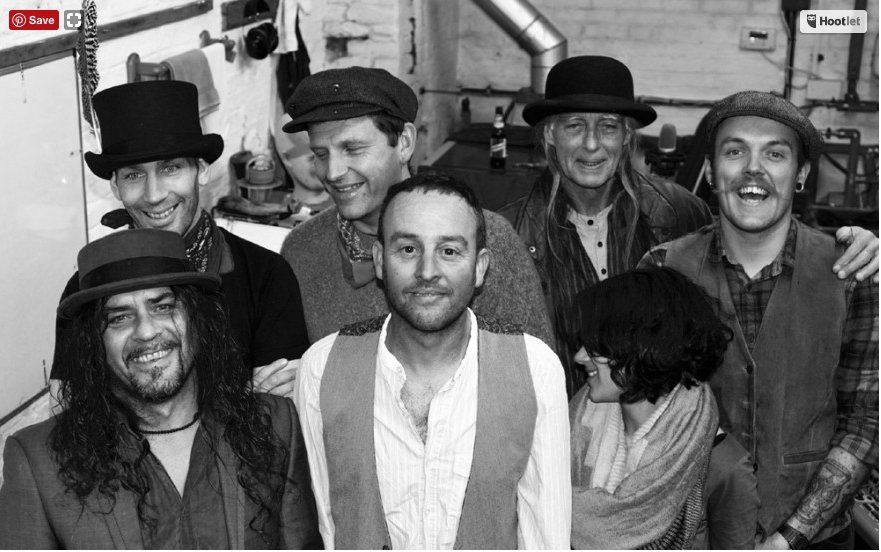 A group of men are posing for a picture in a black and white photo.