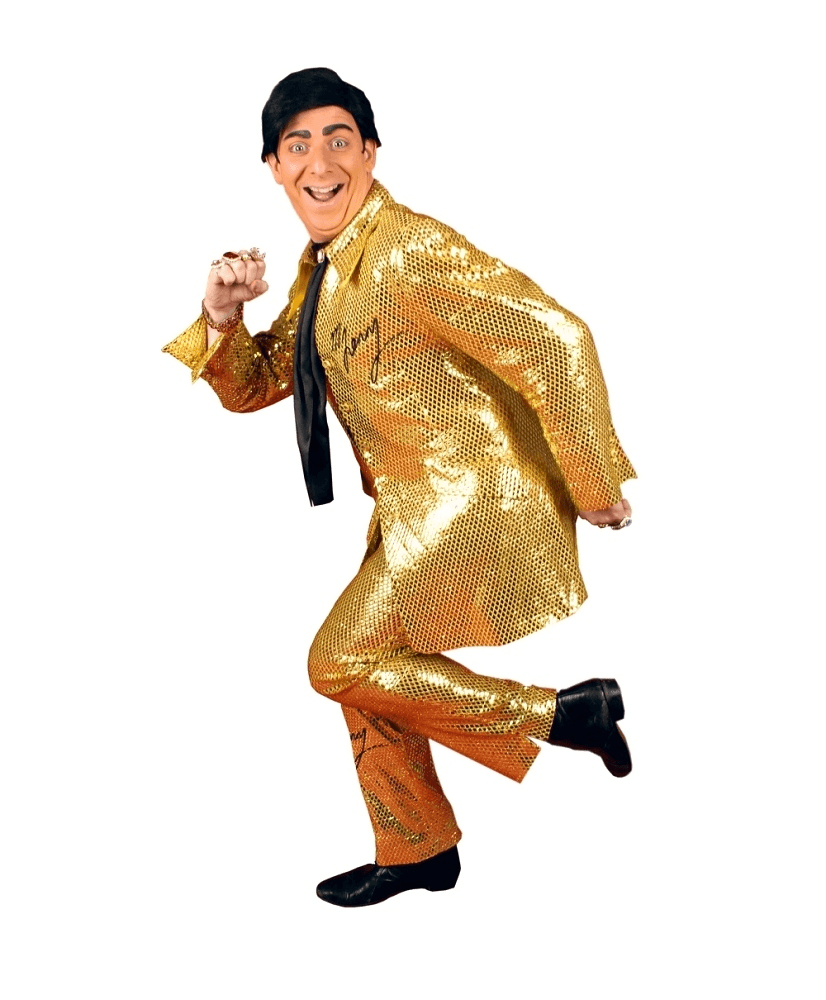 A man in a gold suit and tie is dancing