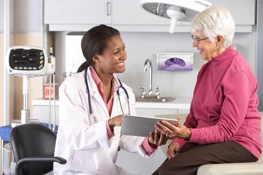 Family Physician In Richmond — Doctor Examining Patient in Richmond, VA