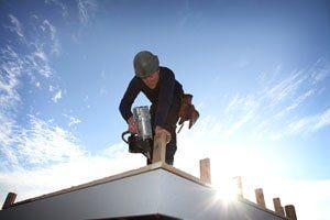 Man Fixing the Roof — Roofing in Salem,OR Man Fixing the Roof — Roofing in Salem,OR