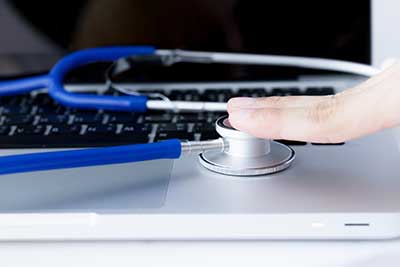Stethoscope on laptop - Auto Insurance in Santa Fe, NM