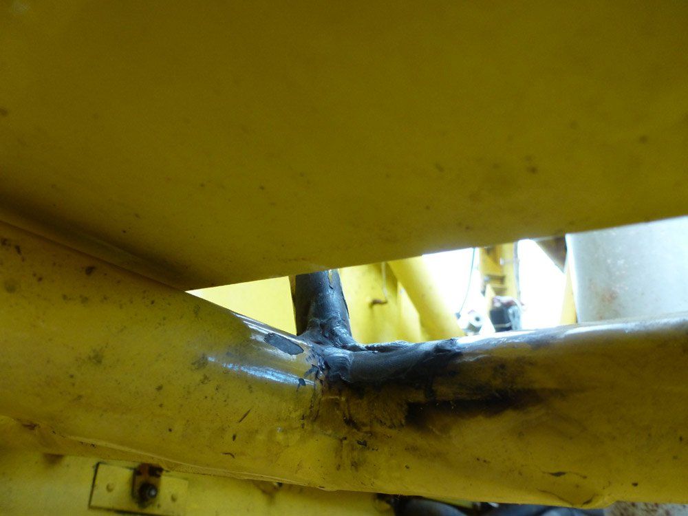 corner weld on a yellow airplane