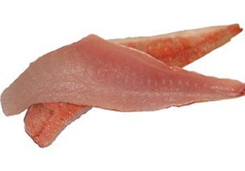 Two raw, pink fish fillets on a white surface.