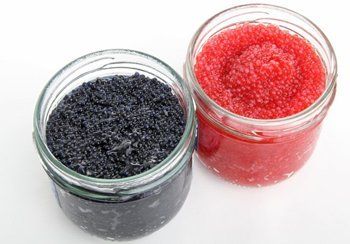 Two jars: black caviar on the left, red caviar on the right.
