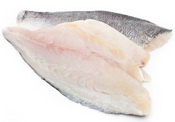 Raw fish fillets, white flesh with gray skin, arranged on a white surface.