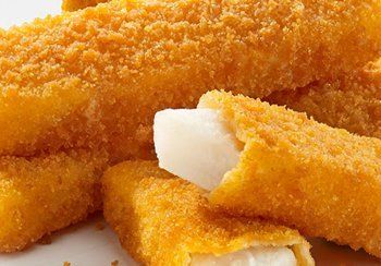 Golden, breaded fish sticks, one showing white fish filling.