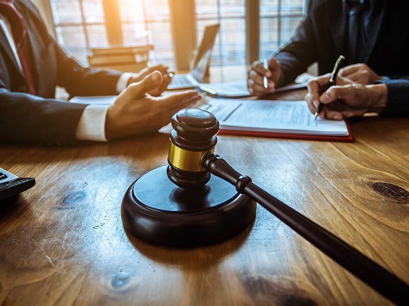 gavel resting on wooden desk