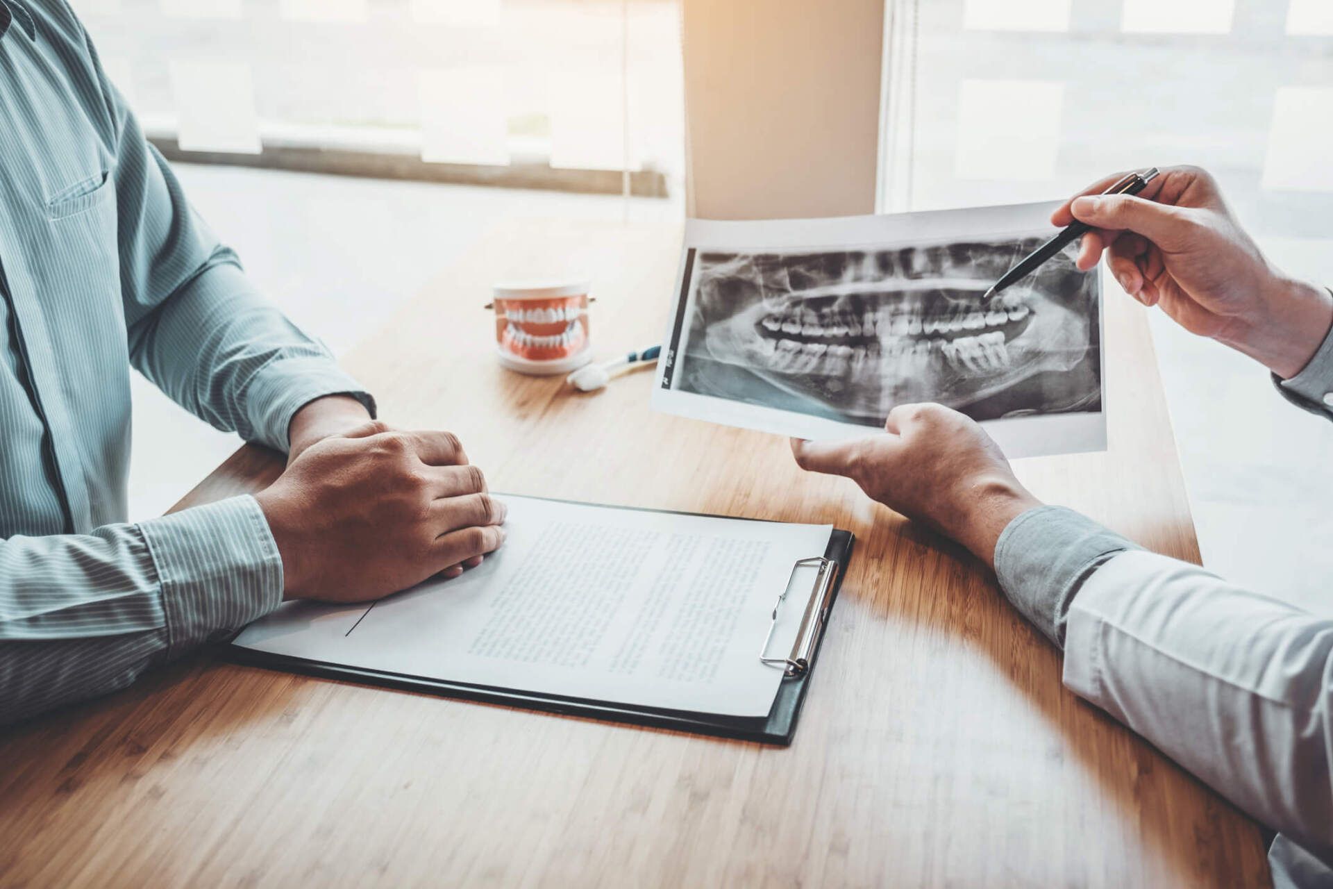 Dentist with Male Patient — Stow, OH — Dr. Edward C Maher Jr.