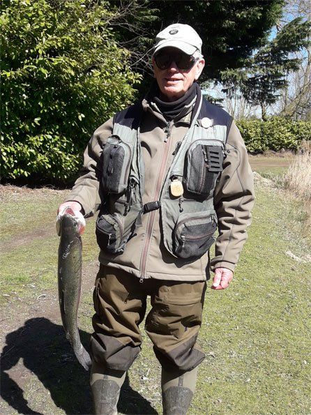 a man holding the fish