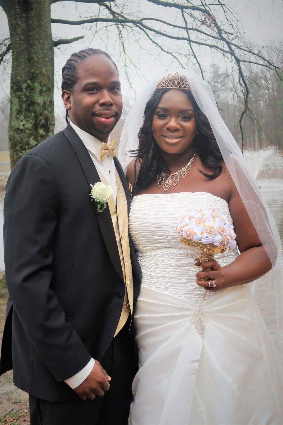 A bride and groom are posing for a picture on their wedding day.