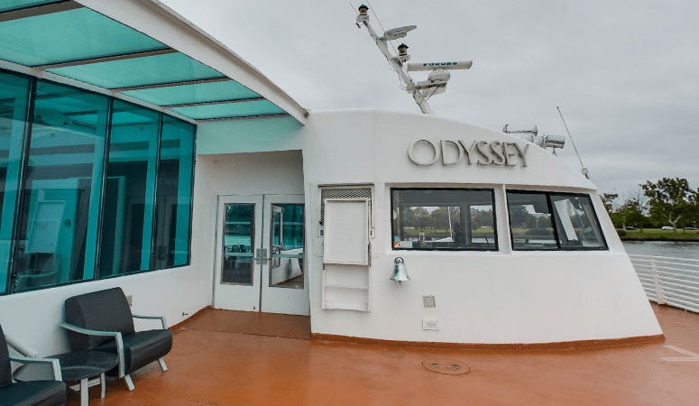 A white building with the word odyssey on it
