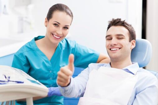 Man giving thumbs up at dentist office - Dentist in Schererville, IN