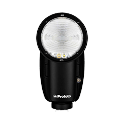 Black Profoto flash head with a round light and LED lights, ready for studio photography.