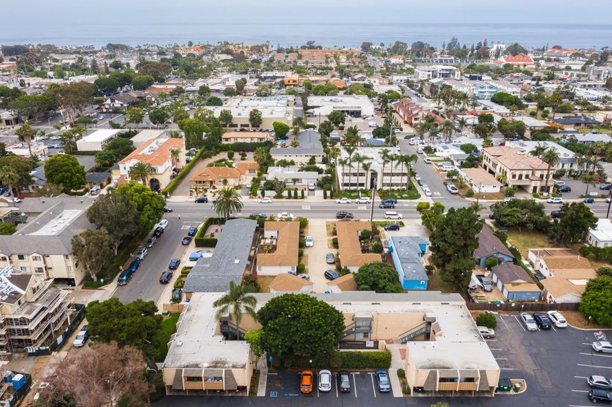 An aerial view of a city with a lot of buildings and trees.