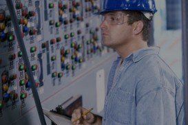 Mid adult man standing in the control room writing on a clipboard Credit - Electrical in Cheyenne, WY Mid adult man standing in the control room writing on a clipboard Credit - Electrical in Cheyenne, WY