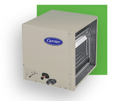 Carrier air handler unit, beige, with Carrier logo, against green background.