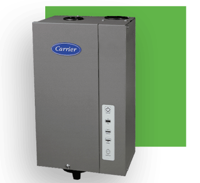 Gray Carrier whole-house humidifier unit with control panel, mounted on a wall with green backdrop.