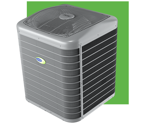 Gray Carrier air conditioning unit against a green background.