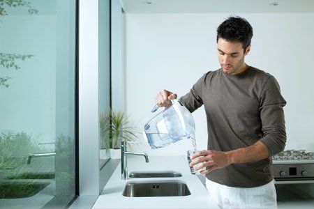 Man Drinking Water - Water Conditioner in Indianapolis, IN Man Drinking Water - Water Conditioner in Indianapolis, IN