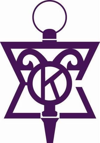 Purple abstract emblem with interlocking triangle, circle, and ornate central design on white background