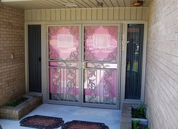 a brick building with a sliding glass door