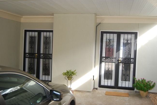 a car is parked in the driveway of a house