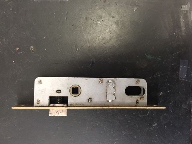 a close up of a door lock on a table